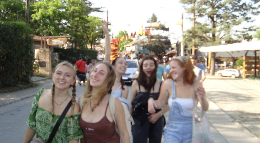 five out of focus girls smiling