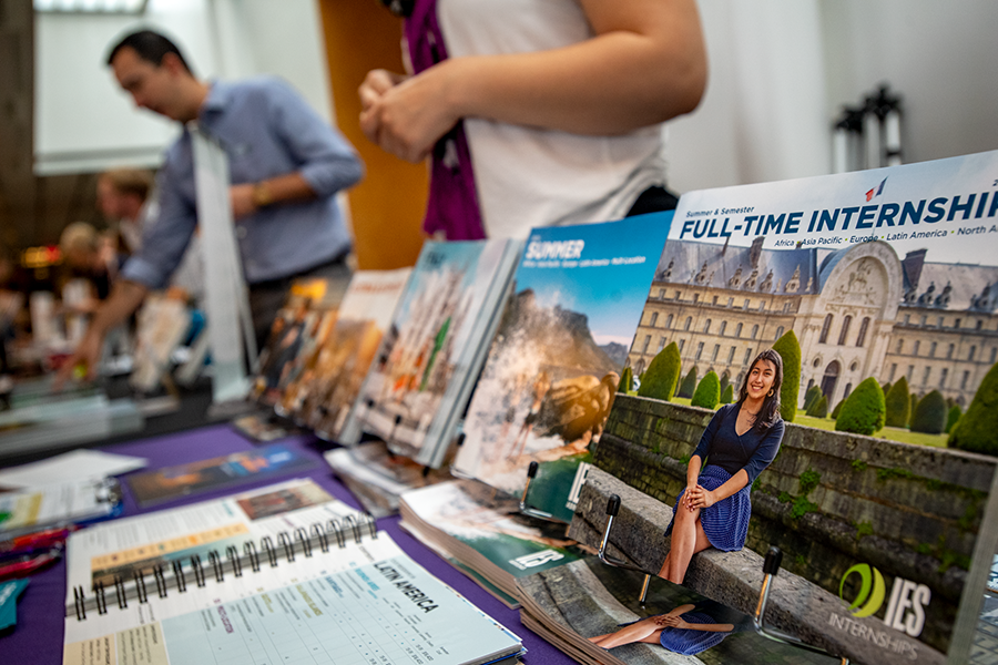 Study Abroad brochures on a table at a study abroad fair