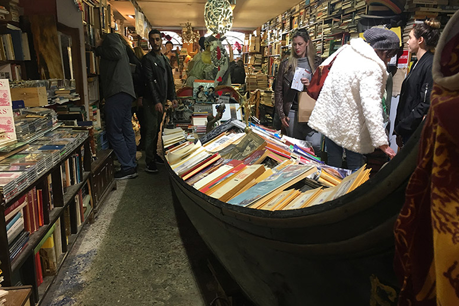 Boat filled with books in a bookstore.