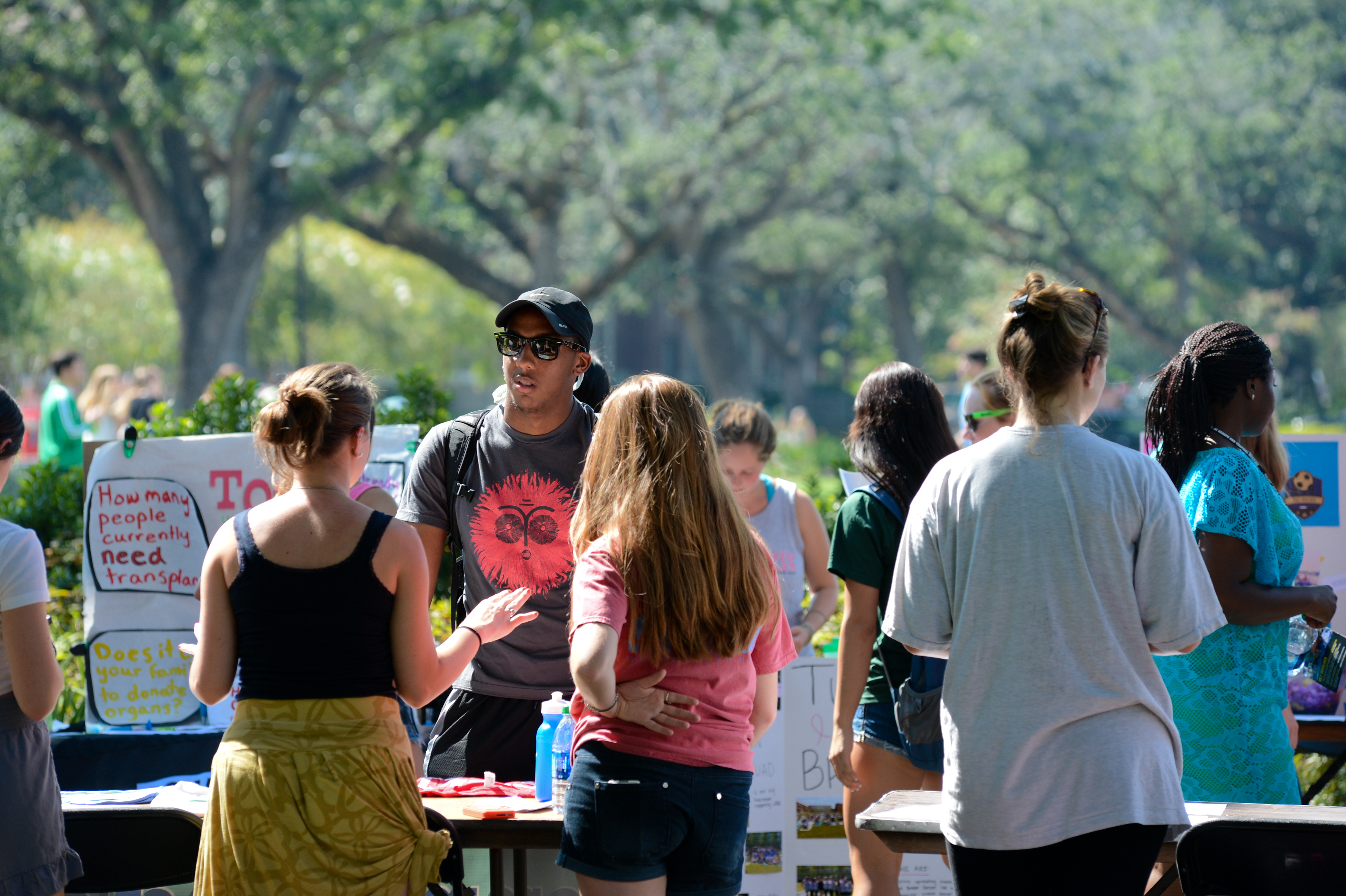 Students at tables for 2013 Activities Expo.