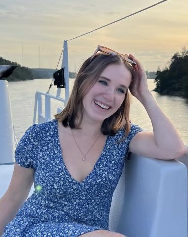 woman smiling outside over water