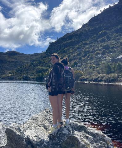 woman standing in front of lake