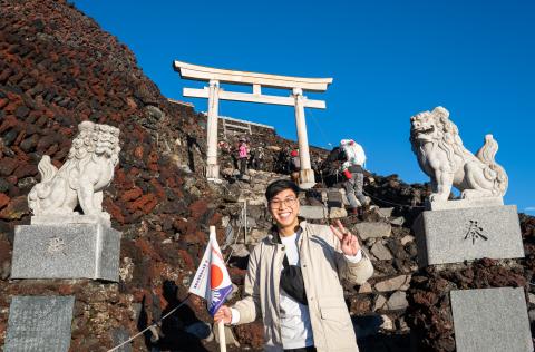 smiling man by Japanese shrine